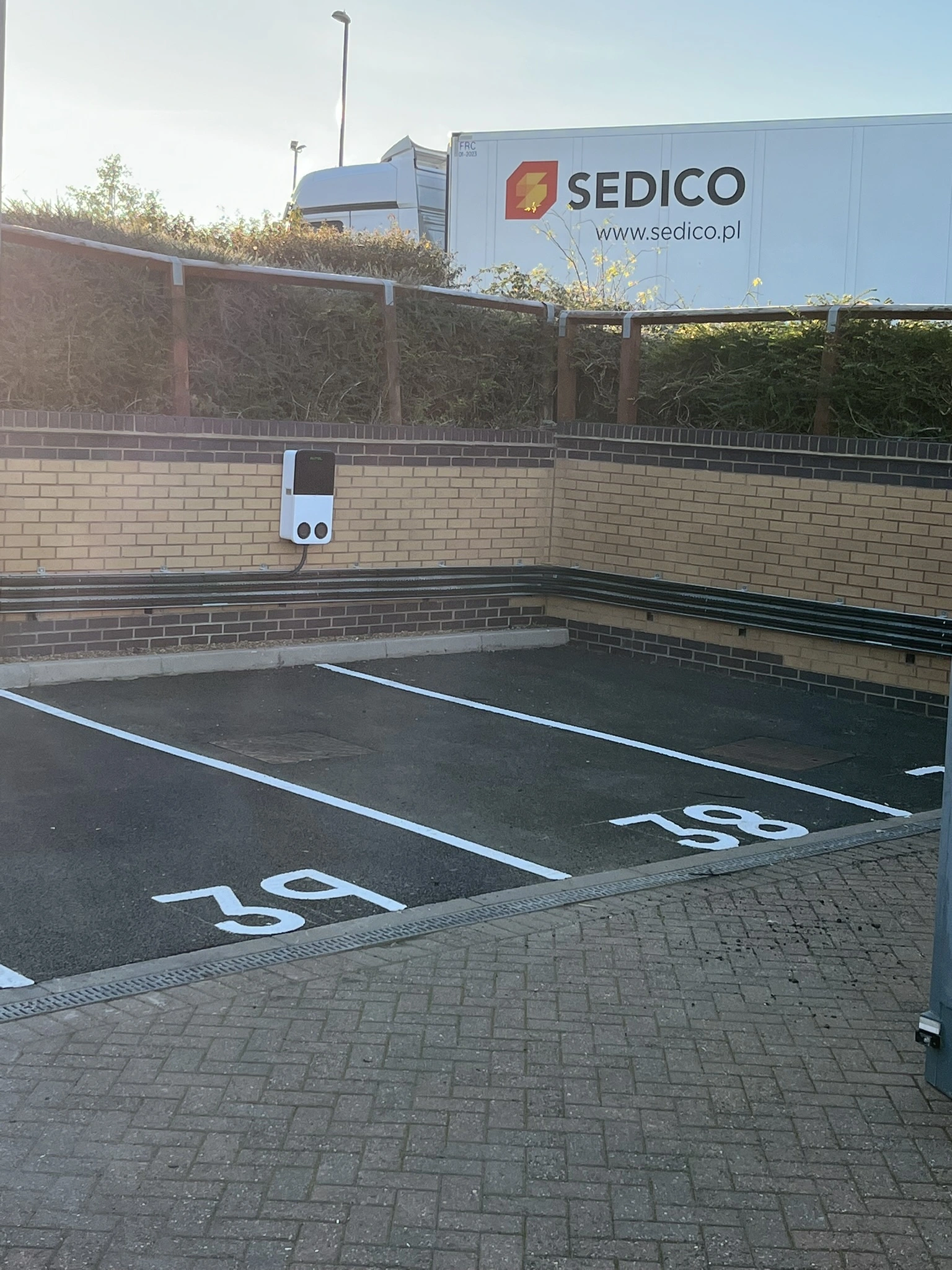 60-bay commercial EV charging hub installed by MARA Electrical in North Wales — 1MVA dedicated supply, Autel MaxiCharger AC Ultra