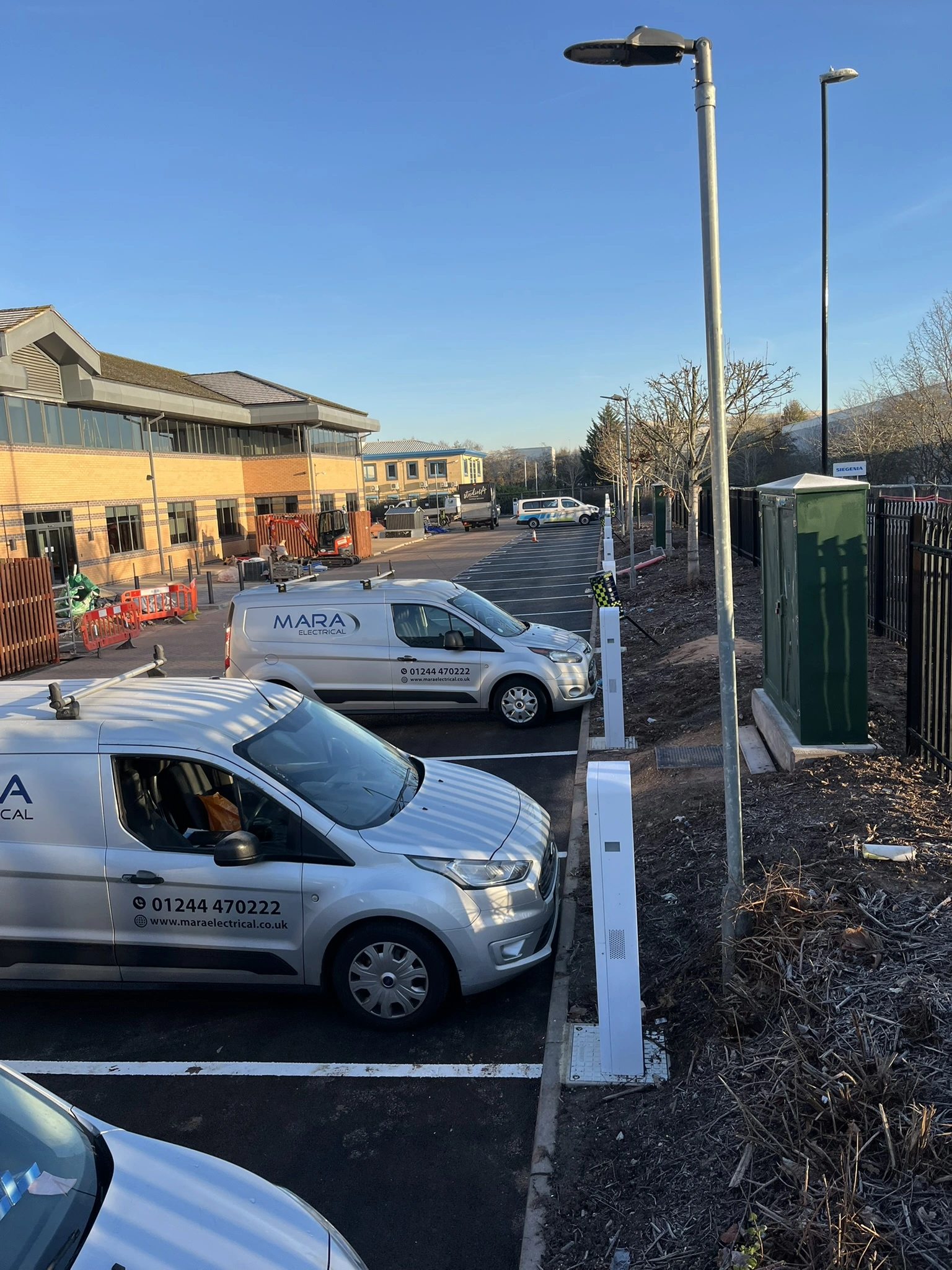 MARA Electrical team installing commercial EV charging infrastructure — NICEIC approved electrical contractors North Wales