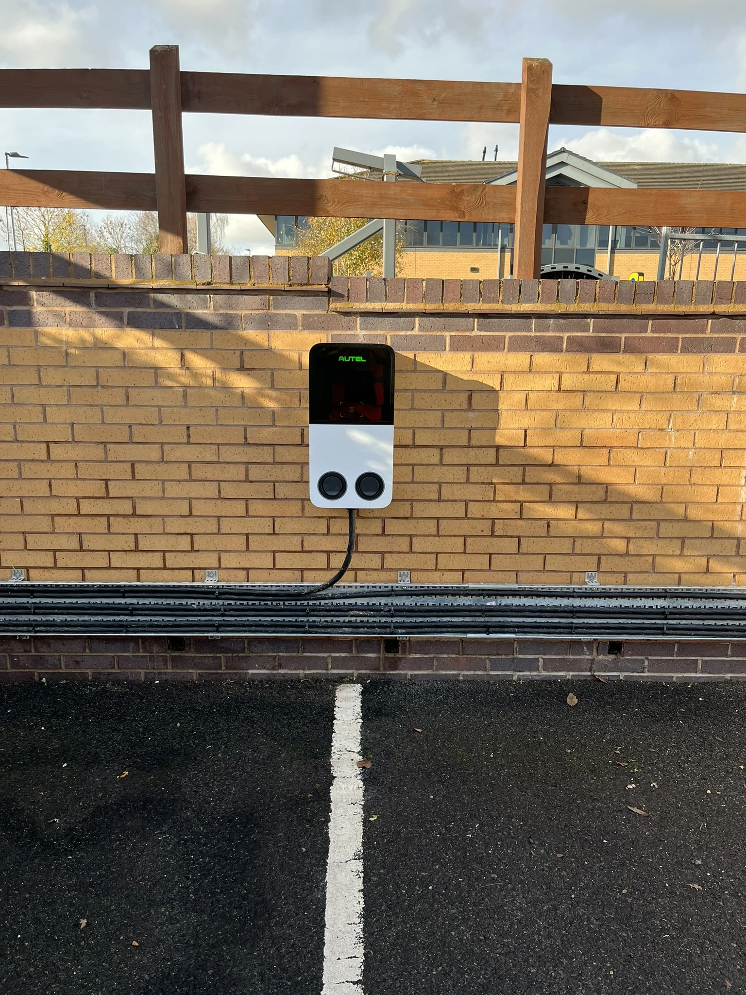 Wall-mounted smart EV charging point installed and certified by MARA Electrical — OZEV approved EV charger installers Deeside, Chester and North Wales