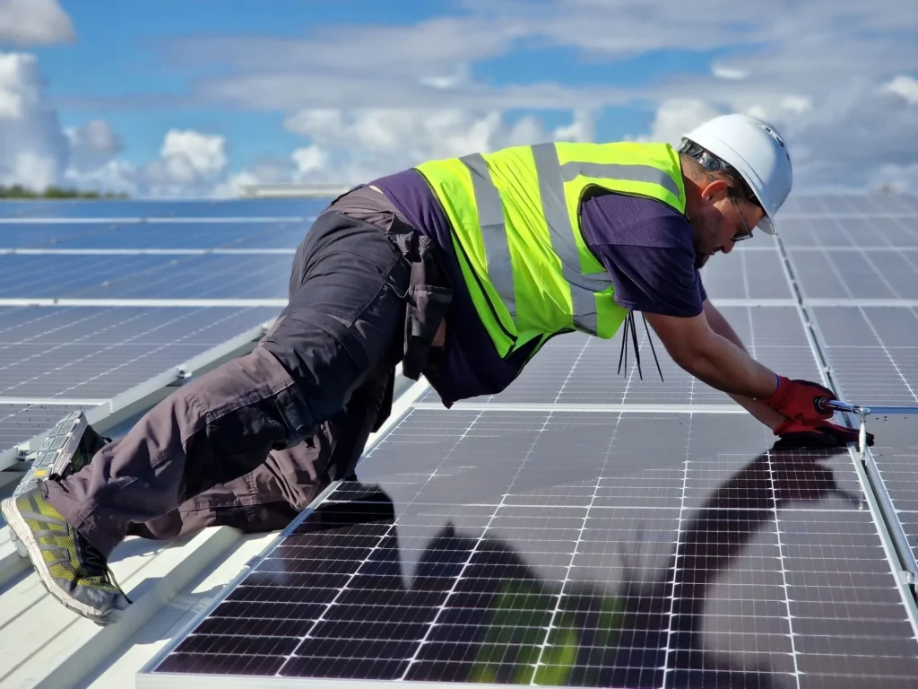 MARA Electrical MCS certified installer fitting solar panels on a roof in North Wales